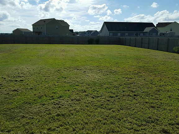 Completely fenced in back yard with privacy fence