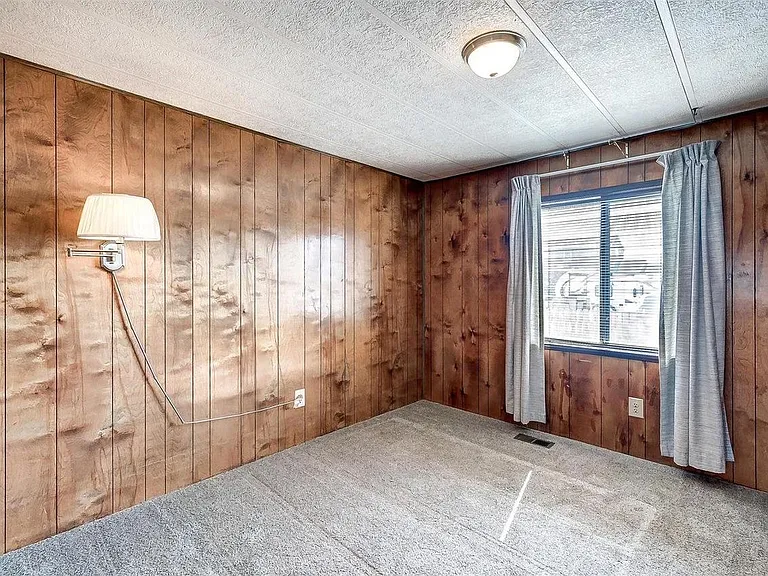 Nice size Bedroom 1 with window south toward South Table Mountain and large closet.