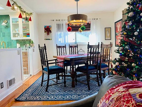 Dining room open to the living room and kitchen.