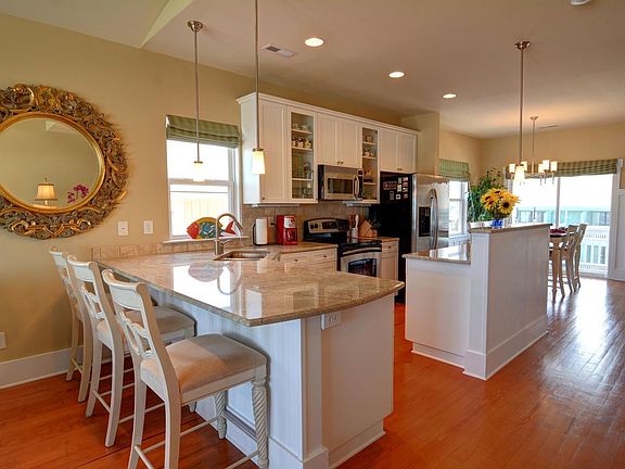 Open kitchen with new appliances and granit counter tops