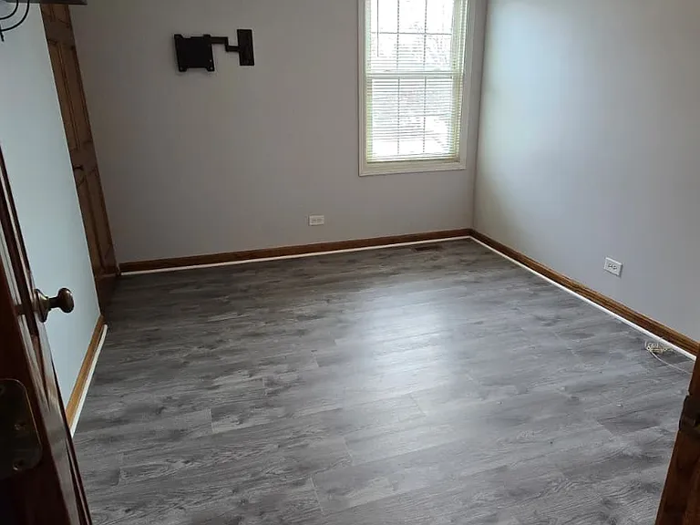 Third bedroom, good for guest or for working from home setup. Room has closet with road side view window