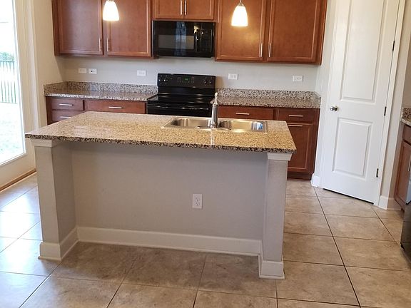 Kitchen - pantry on the right, sliding door to covered porch on the left