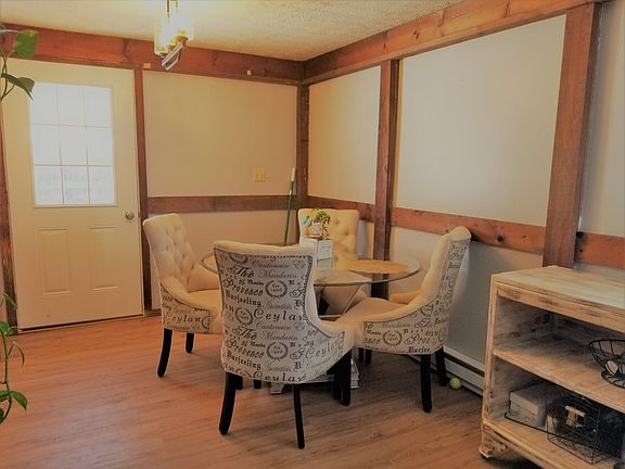 New dining room with new back door, new lighting, new flooring, and new heating! Deck just outside the dining room door!