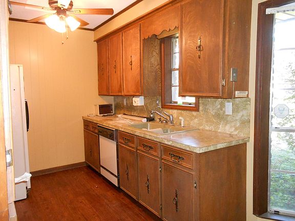 Kitchen with dishwasher, stove and new refrigerator