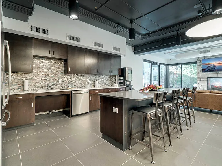 A stylish community kitchen makes it easy to gather, cook, and entertain in a modern space.