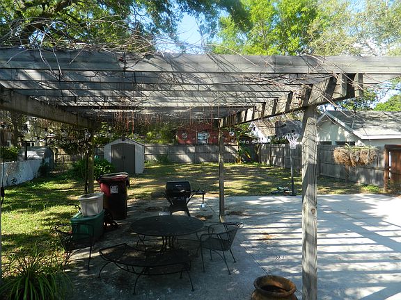 Backyard pergola is perfect for BBQs