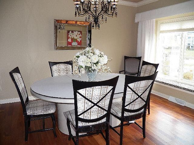 Formal dining area has wood floors
