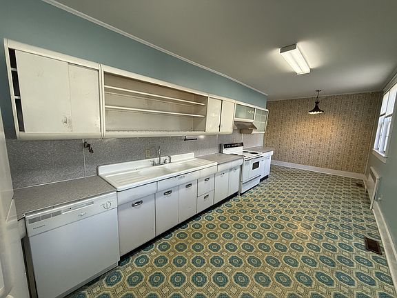 Kitchen with eat-in dining space: Check out the cool old metal cabinets!