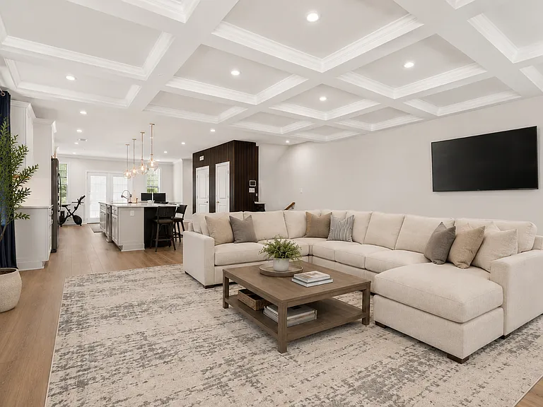 Living room with kitchen and dining area (photo is virtually staged)