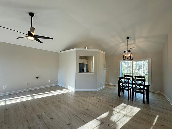 Family room with vaulted ceiling and new fixtures