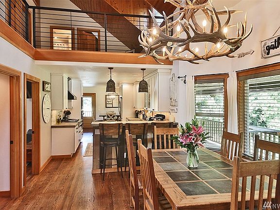 Dining Room also has vaulted ceiling, beautiful oak floors & custom chandelier.