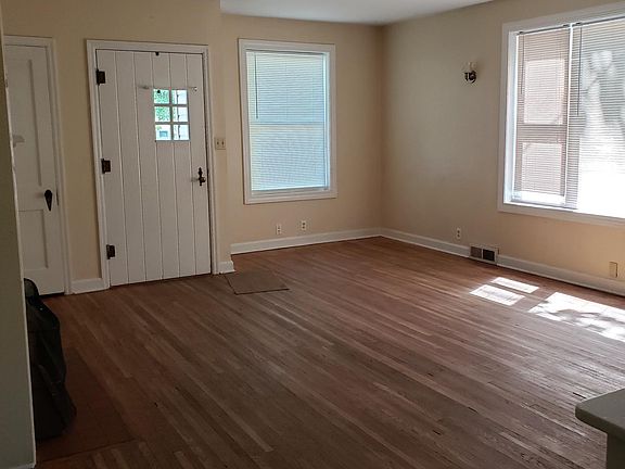 Living room looking from Dining room to front door