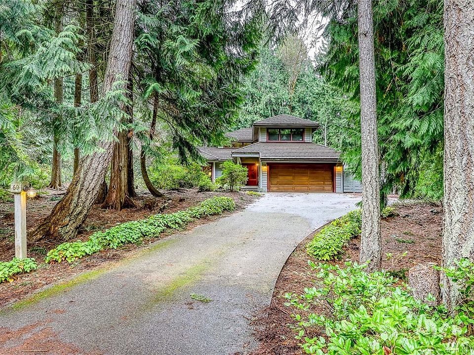 Home is nestled back off street and sits on double lot providing privacy.