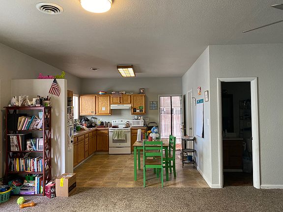 View of eat-in kitchen. Also, view of bathroom entrance.