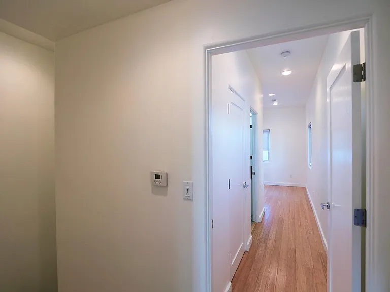 Hallway Leading to Rear Bedroom