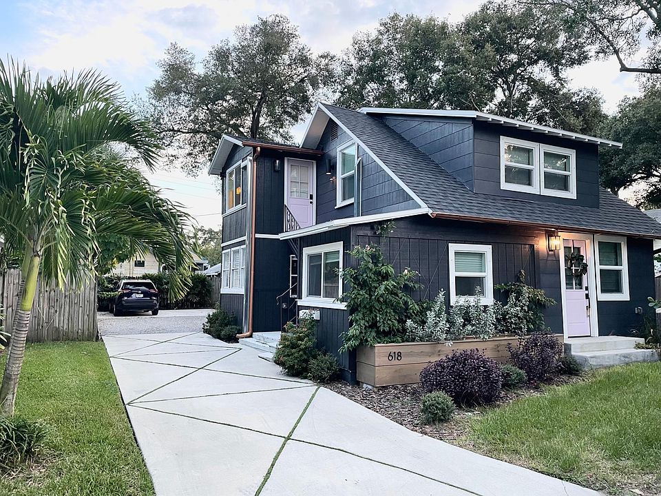 Exterior View and parking pad in rear of home