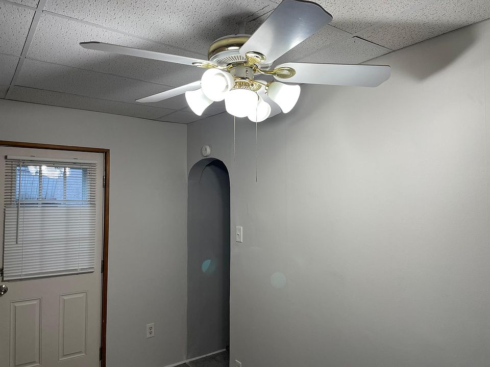 Eat in kitchen with a ceiling fan