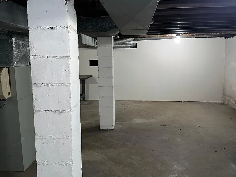 Unfinished Basement with Washer and Dryer
