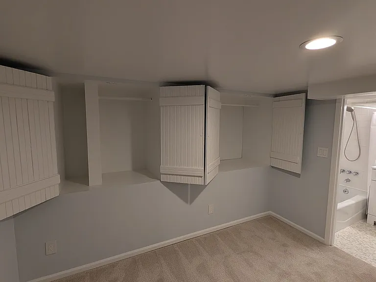 Downstairs extra bedroom with tons of storage space