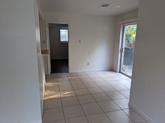 Dining Room with Glass Door to Small patio