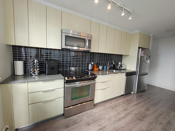 Kitchen. Large and small appliances pictured are included.