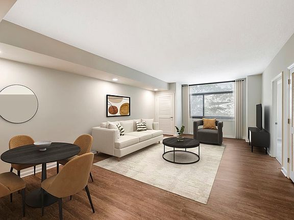 Updated Finishes living and dining area with hard surface flooring