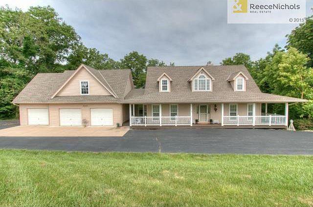 Situated on almost 5 acres of woods, this 1.5 story home is loca