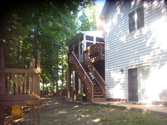 wooded lot, screened porch, deck, patios, fenced yard