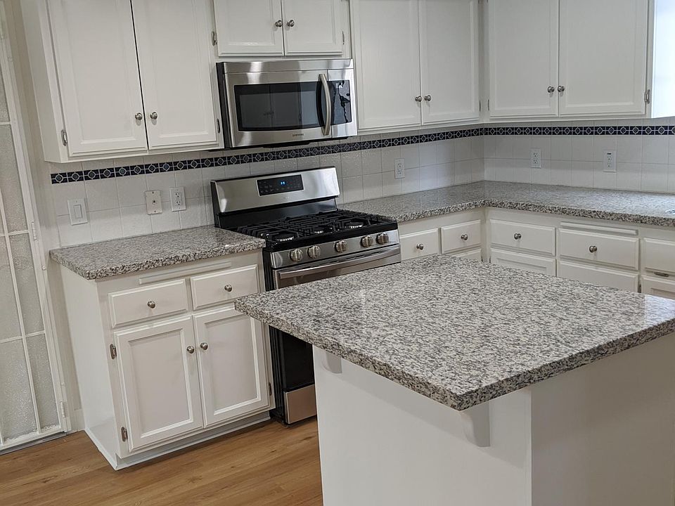 White cabinetry, new granite LED Lighting and new appliances