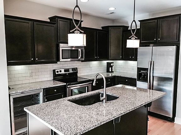 Kitchen with granite countertops,new backsplash, Wine fridge