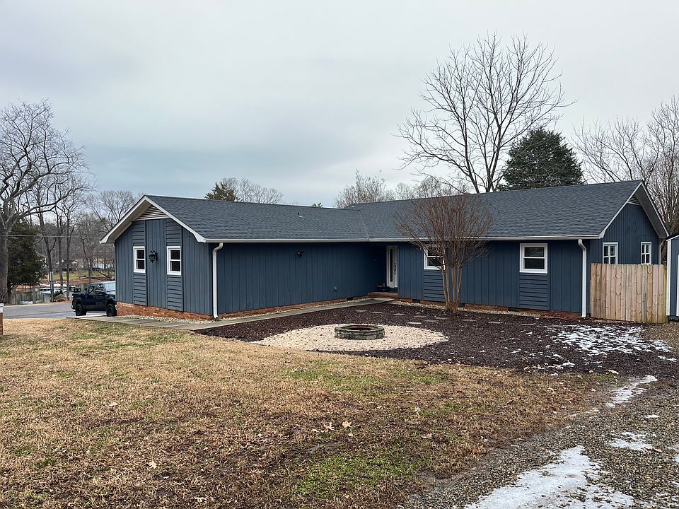 Large front yard, corner lot with fire pit.