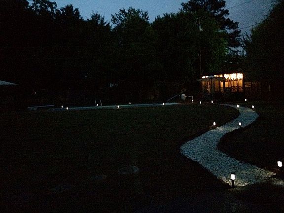 Pathway in back yard to pool