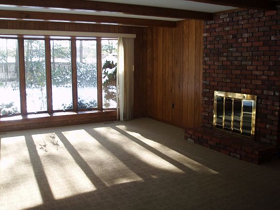 Family with fireplace opens to patio