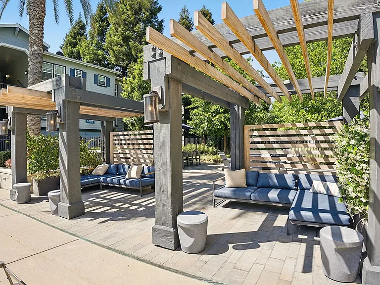 Take ruge under the shade of a trellis on a built-in wood lounger or spread out your favorite blanket for a picnic on the grass