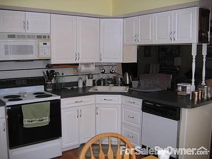 Kitchen
						:
						Recently painted cabinets with new hardware and sink fixture.