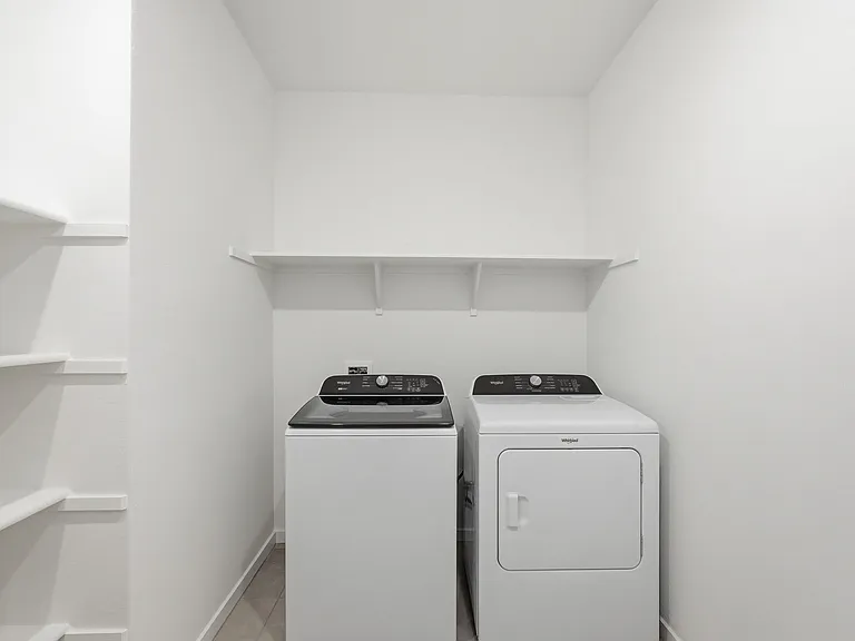 Laundry with new washer/dryer and storage!