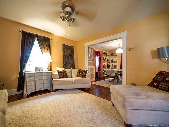 Living room with high ceiling and open to the foyer and dini
