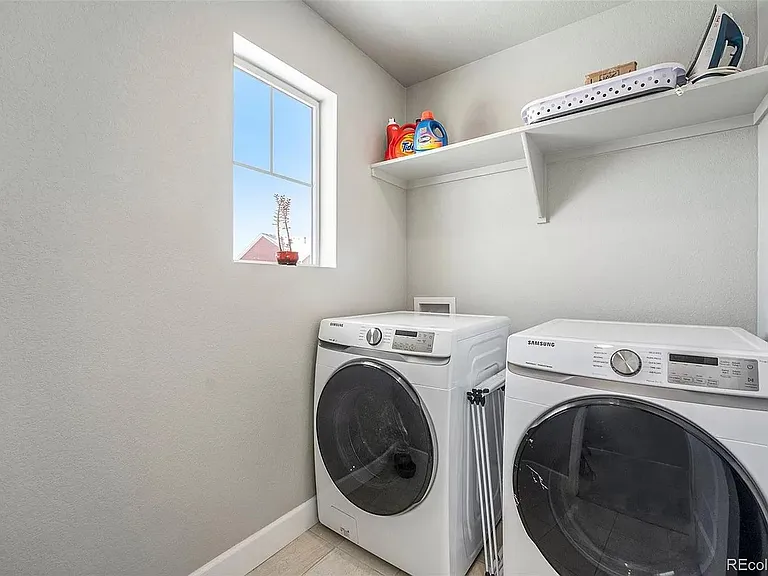 Conveniently located dedicated laundry room with in unit Washer- Dryer on second level.
