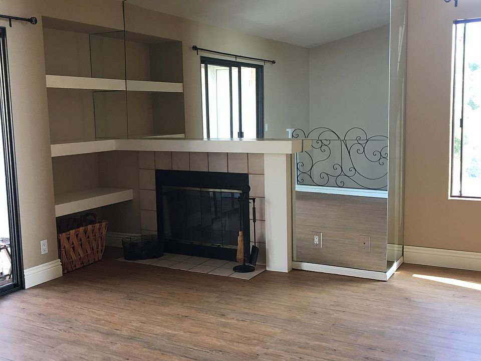 Giant sunny windows. Vaulted ceilings. Mirrored fireplace. L