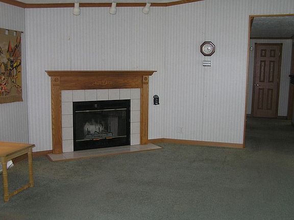 Corner wood burning fireplace
