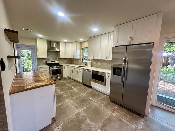 Kitchen. All stainless steel appliances. Butchers Block island.