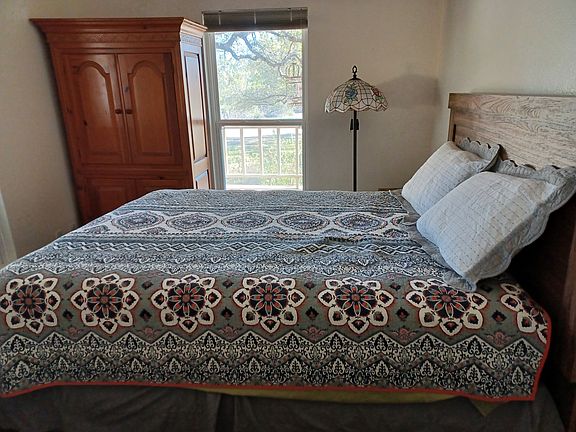 Queen bed, small desk, armoire with closet, storage space & private bathroom. Bifold doors can close off thisarea for more privacy.