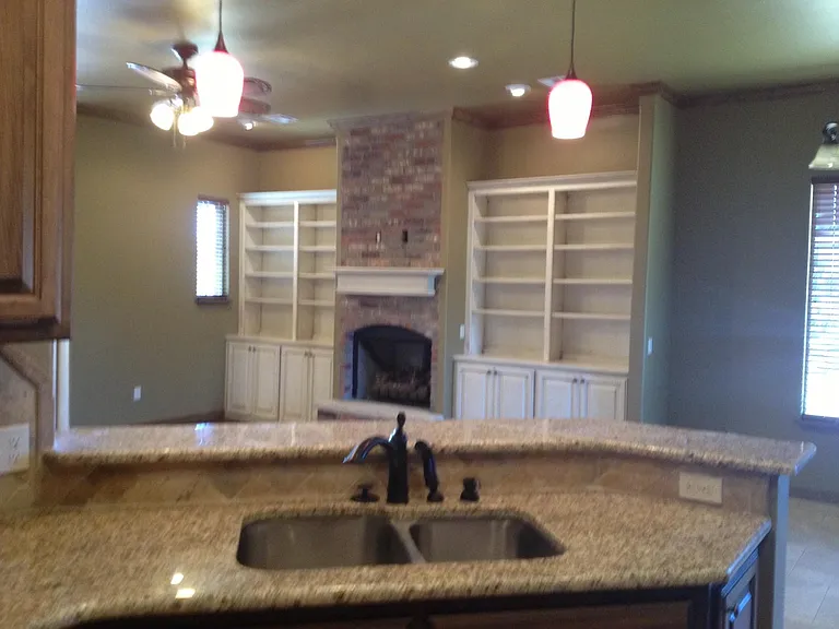 Now that our furniture is out of the way you can see the open floor plan for the kitchen towards the living room.