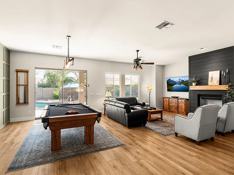 Spacious family room featuring a stunning high-end pool table - perfect for game nights.