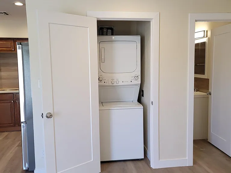 Waher / Dryer and Hallway to Bathroom and Bedrooms