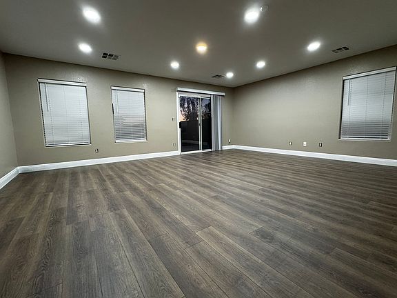 Spacious great room with plenty of natural light and direct access to the backyard patio.