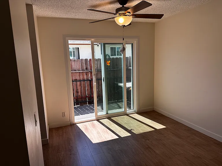 Dining Room with Small Private Patio Access, Kitchen to the Left. The outside wood patio surround has since been replaced (new follow to be posted soon)