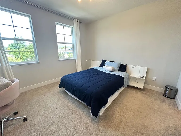 Primary bedroom with view of nearby hills