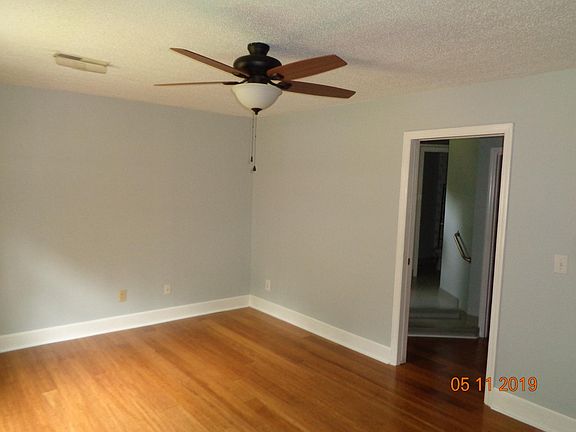 Master bedroom with bamboo flooring, bathroom and walk in closet.