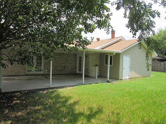 BACK PATIO, FRENCH DOORS TO MASTER BEDROOM ON LEFT